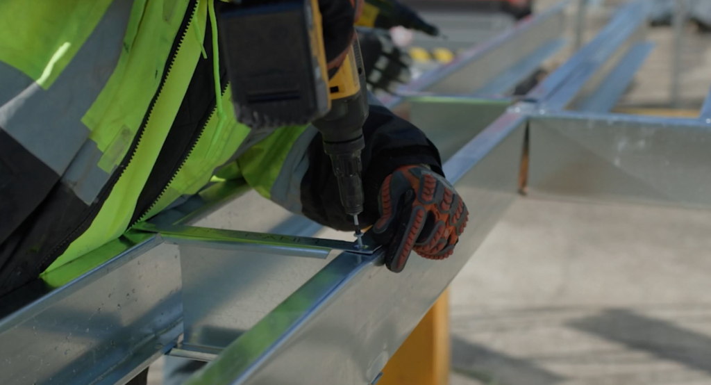 Staff working on Butler parts at a construction site. 